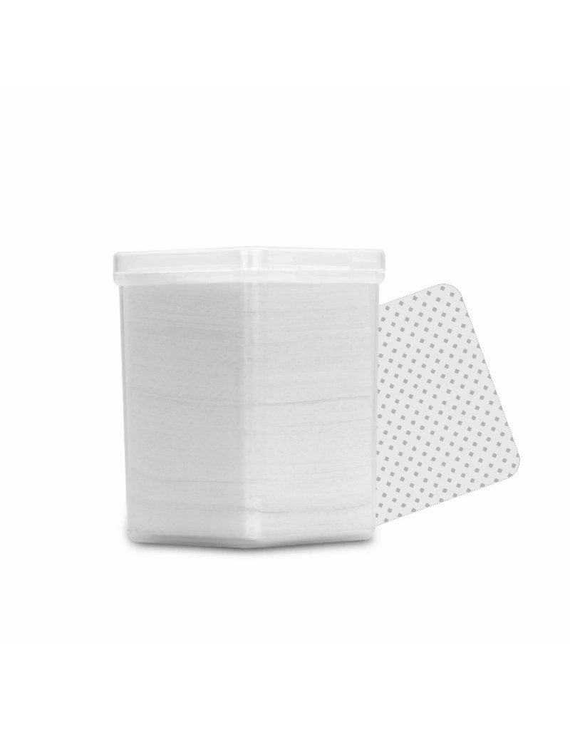 Lingettes sans fibres pour adhésif